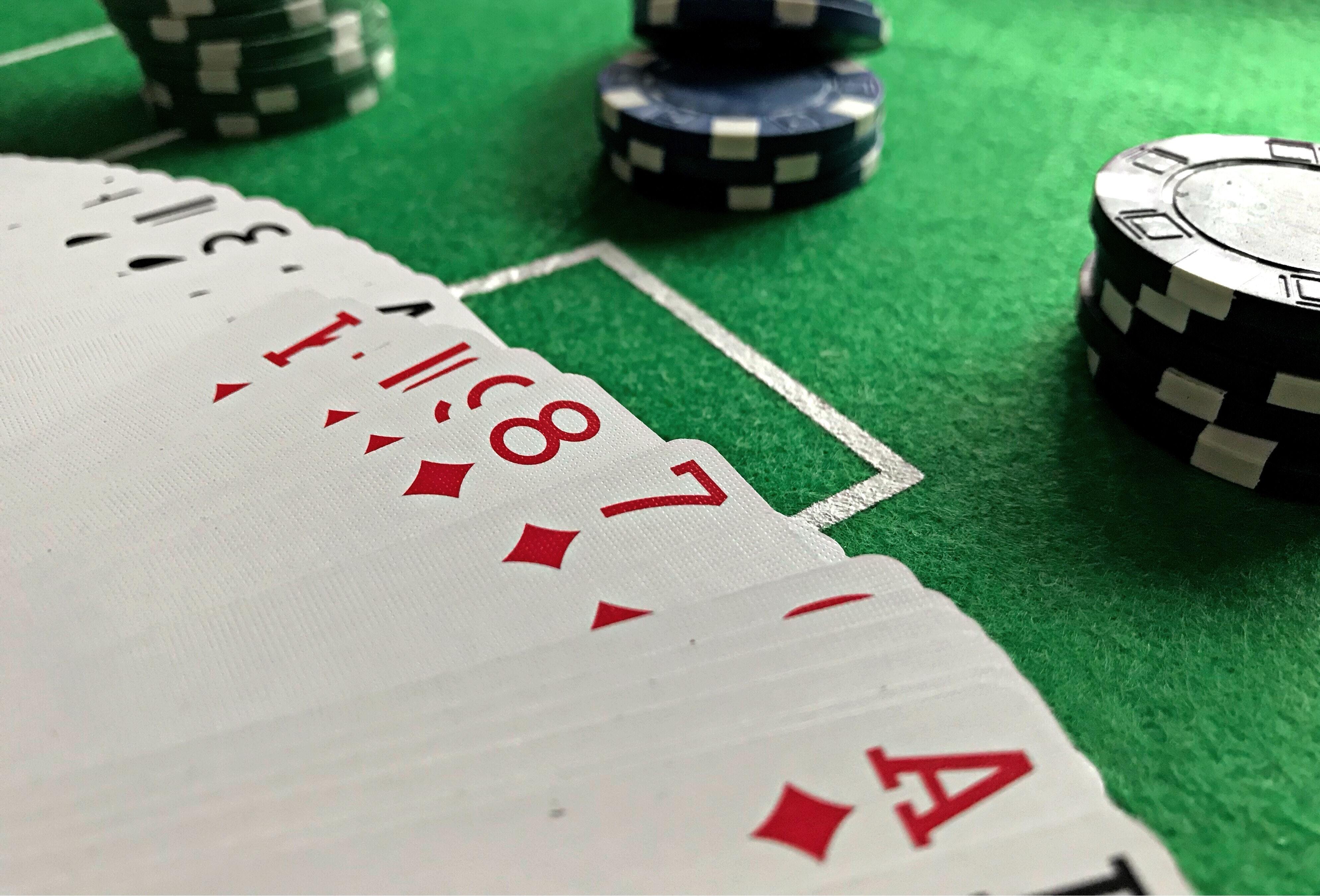 Happy Group Of Adults Gambling At Craps Table Stock Photo